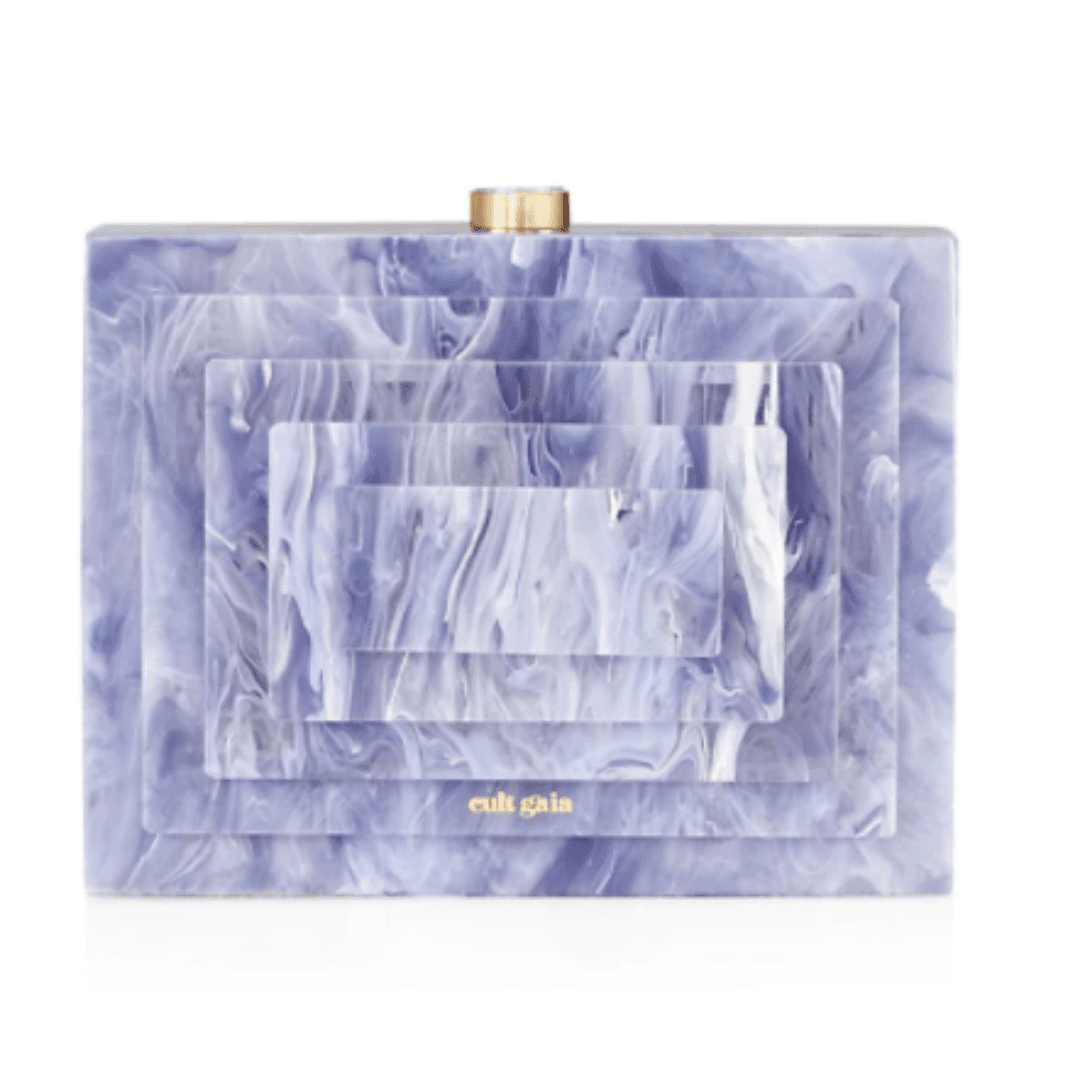 Cult Gaia Saks clutch with a geometric design and shades of purple.