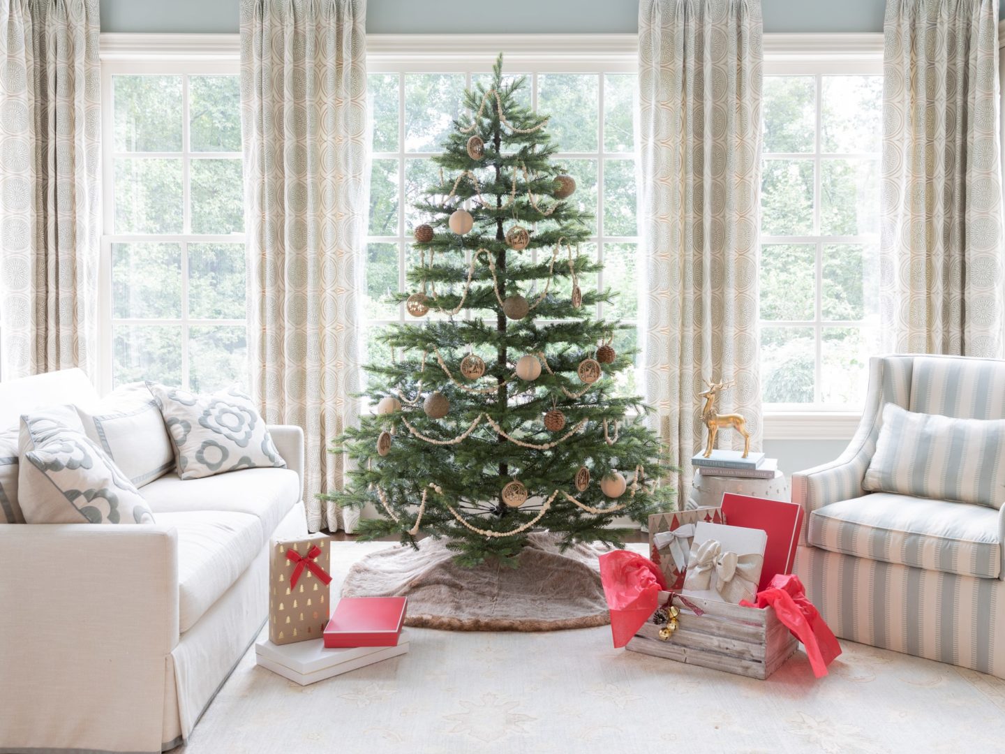 Using simple wood ornaments and ribbons I created this rustic themed tree.
