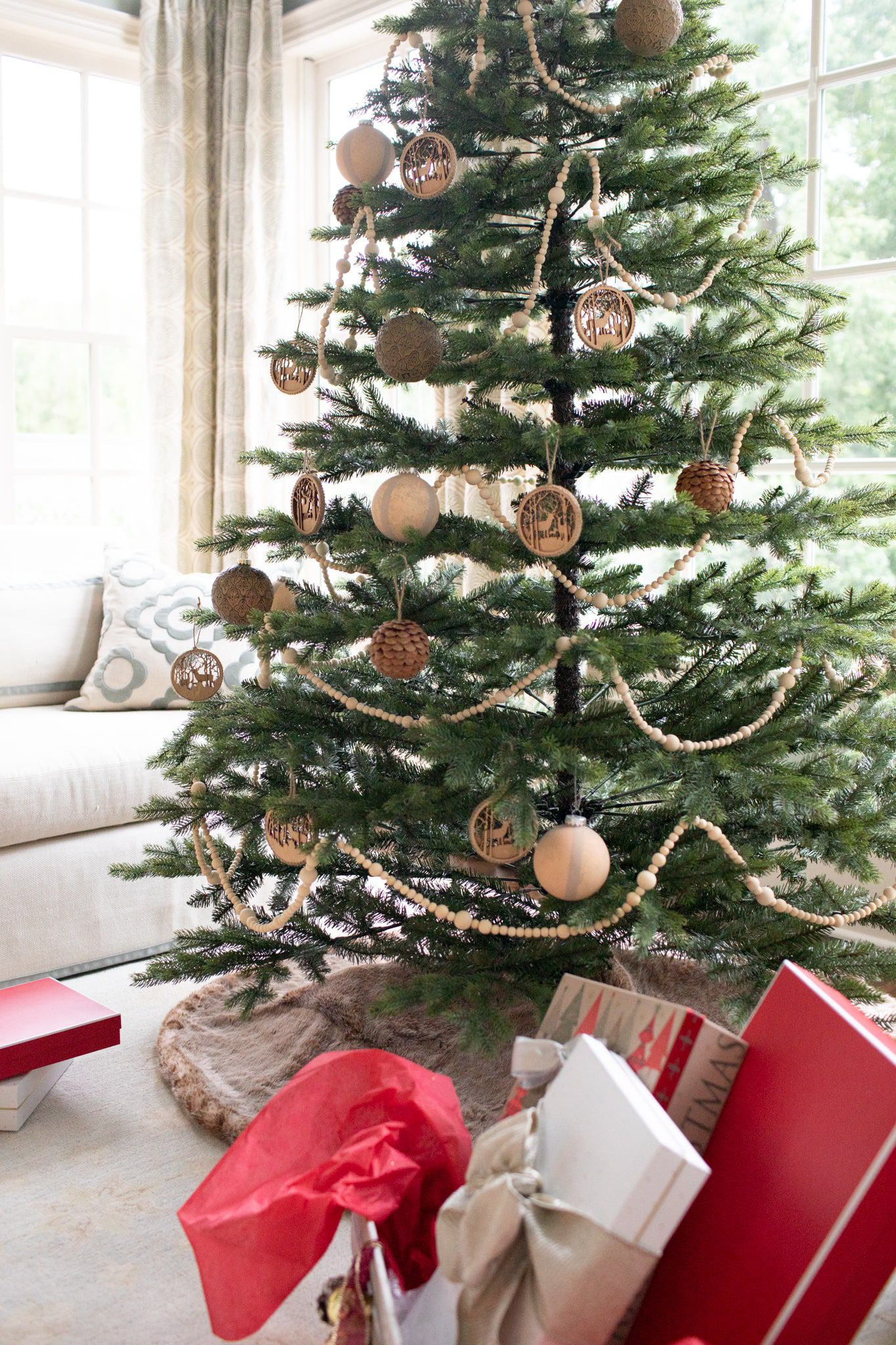 Wood garland and wooden ornaments used to create a unique rustic tree.