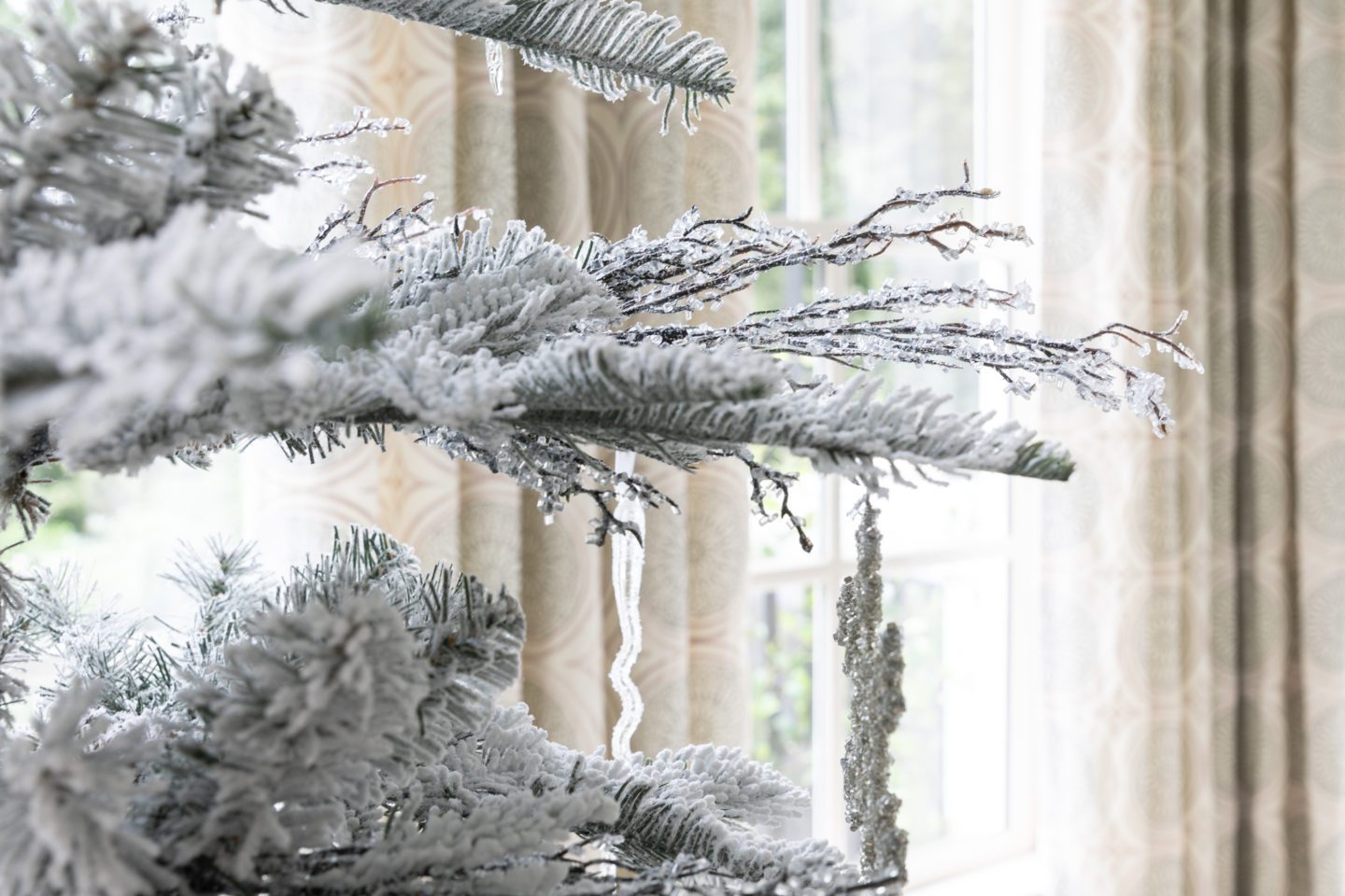 Crystalized branches on a flocked Christmas Tree.