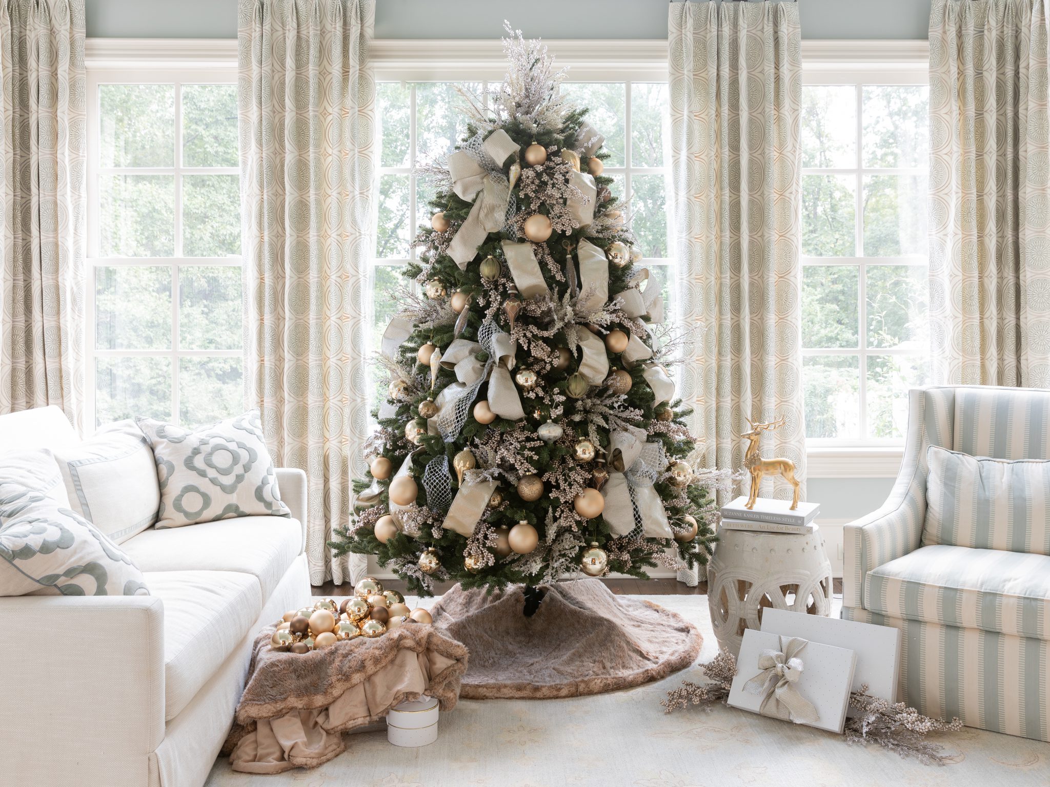 Traditional green tree covered in gold and sparkle decor