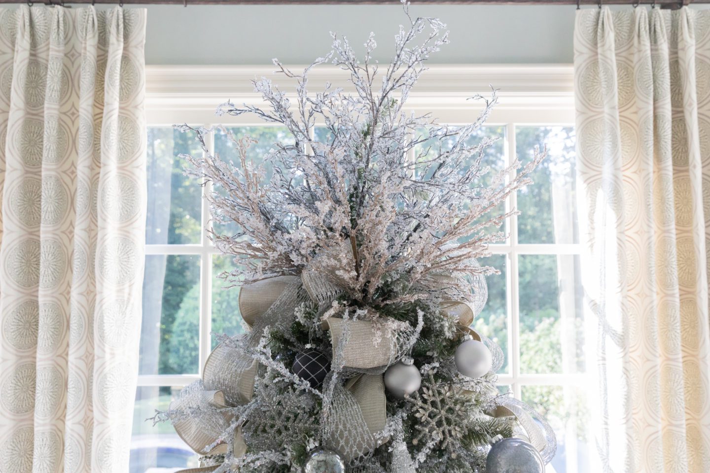 DIY Tree topper using silver and gold tree picks on a flocked Christmas tree