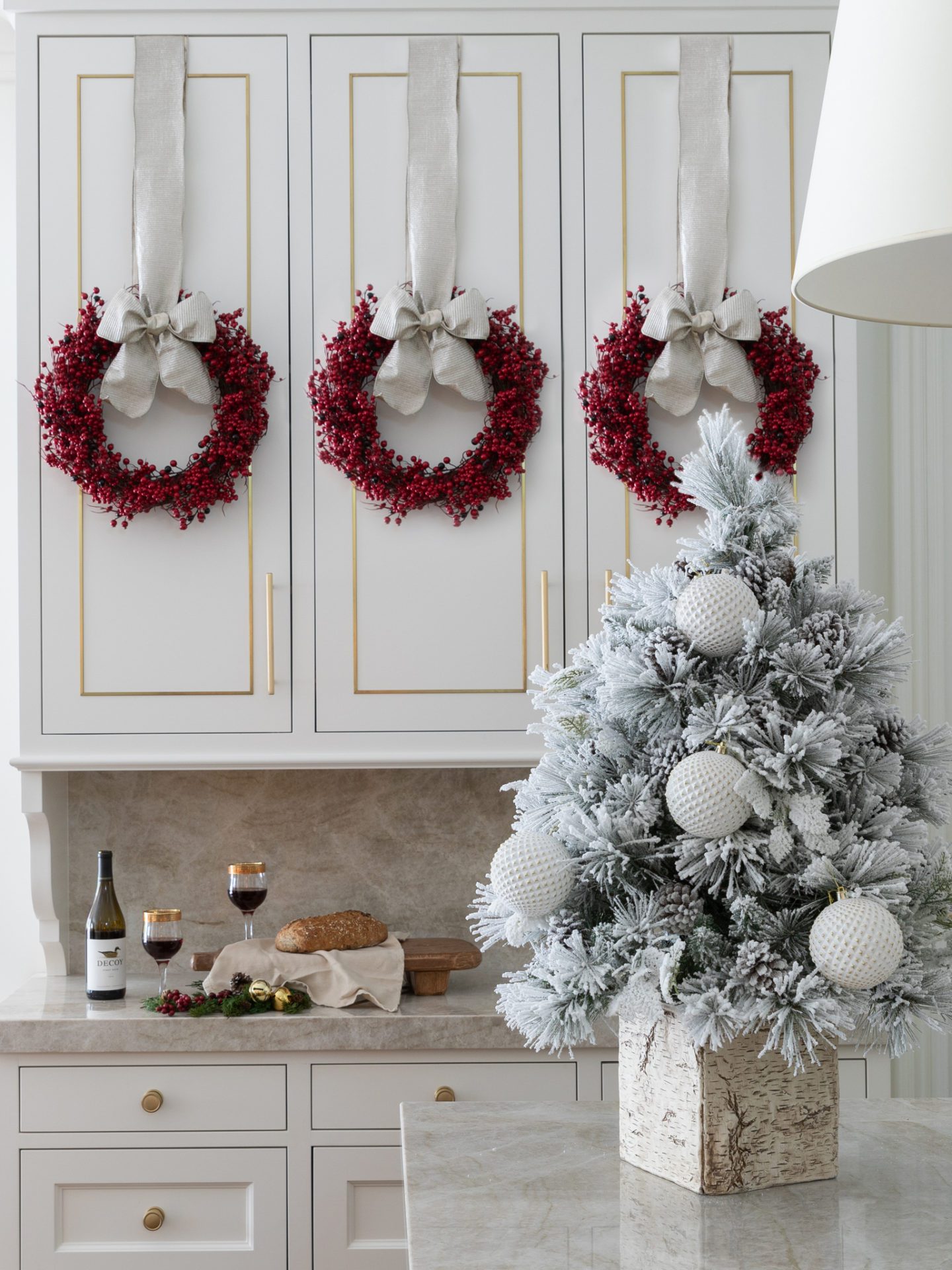 Small flocked tree on a kitchen countertop