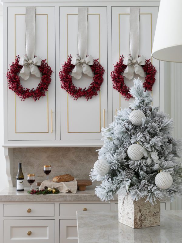 Small flocked tree on a kitchen countertop