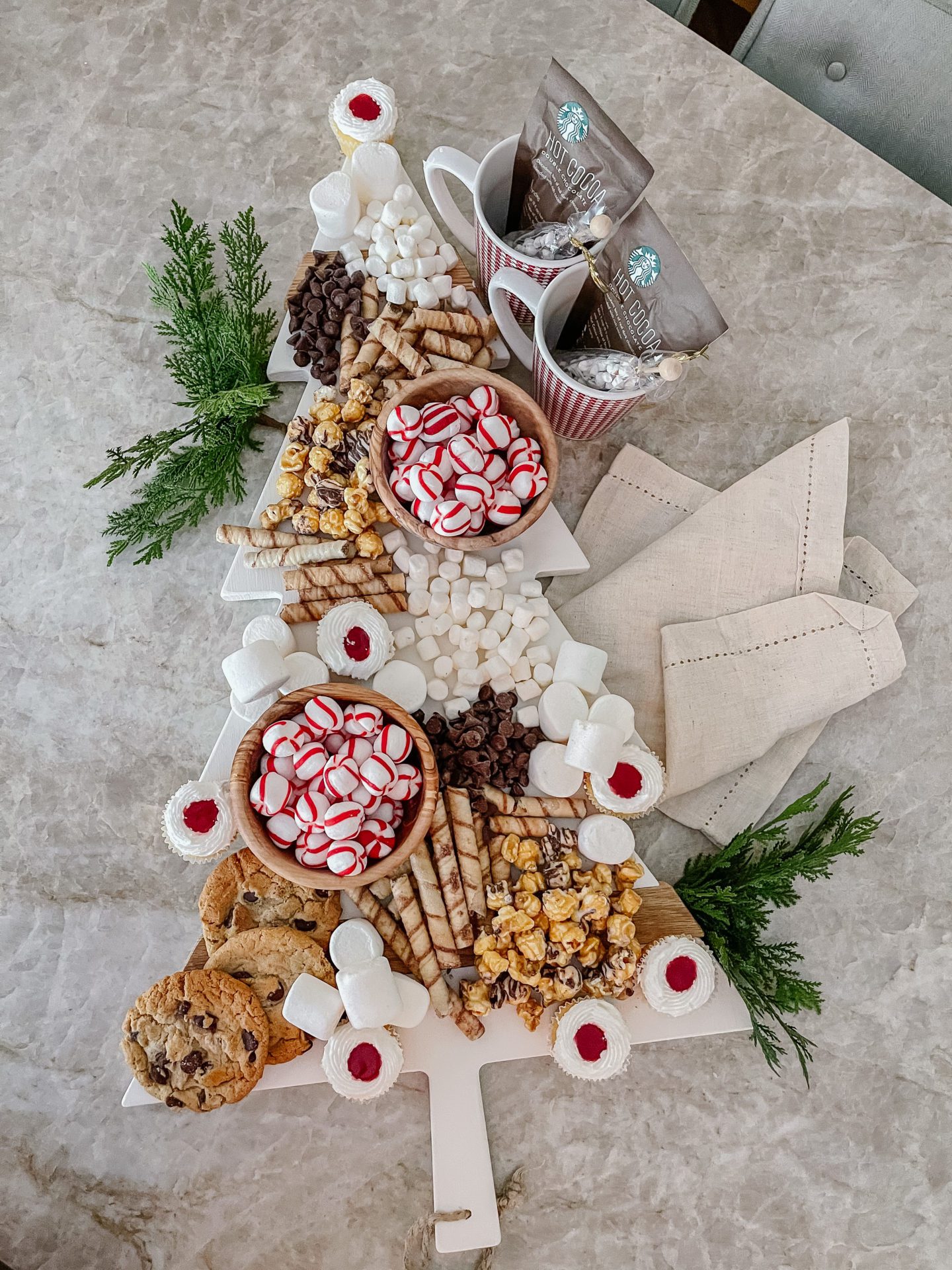 Throwing a party and need a Christmas Charcuterie Board? This Christmas Tree Charcuterie Board will take less than 5 minutes to make!