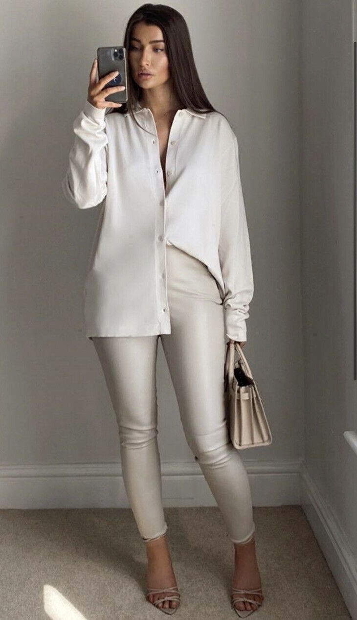 White leather leggings and nude sandals.