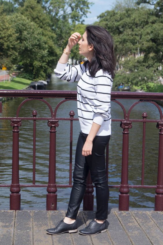 Black leather leggings and Oxford shoes.